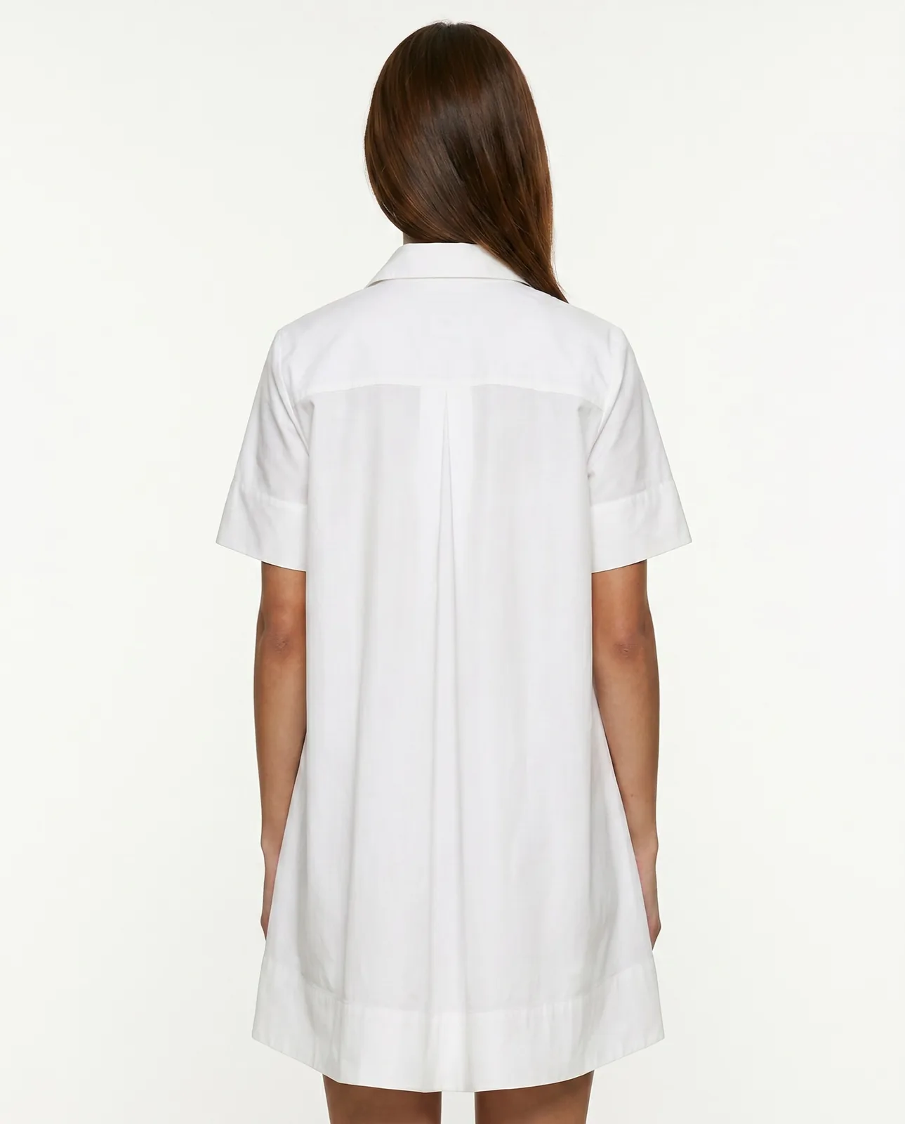 Back view of a white short-sleeved shirt dress on a model against a plain white background, the kind of frame a shop page uses